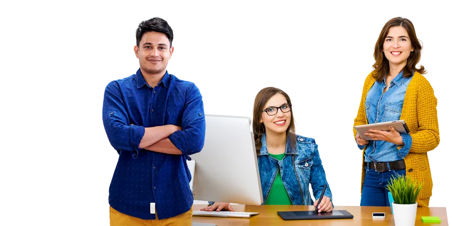 Three smiling colleagues gathered around a desk, ready to work together